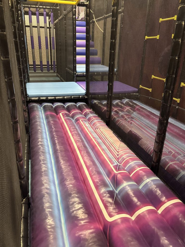 Roller slide lit in pink and purple